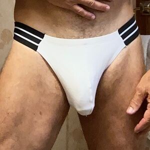 White brief with black band, tag L but fits like medium.
